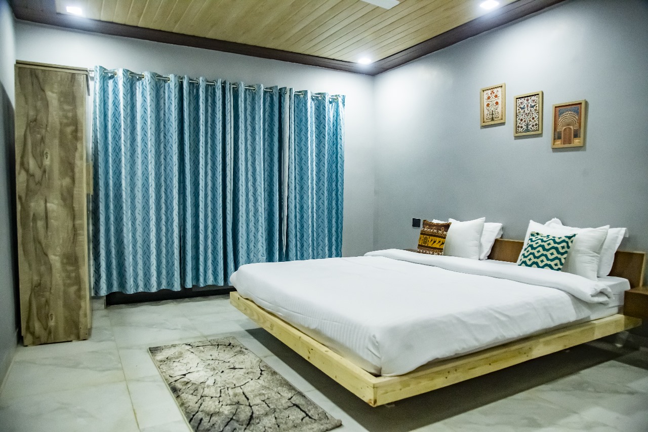 Spacious master bedroom with wooden ceiling